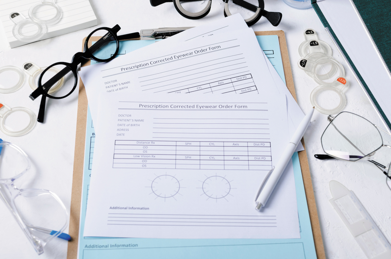 Detailed view of an optical prescription eyewear order form with glasses and lenses