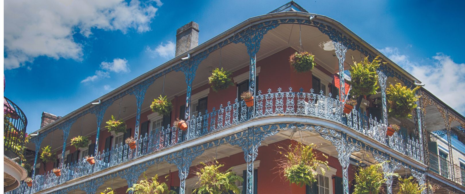 Photograph of an old building in New Orleans with prominent balconies.