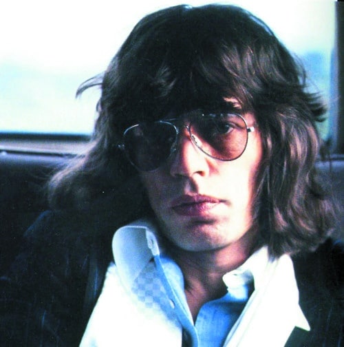Vintage photo of Mick Jagger in aviator eyewear, illustrating the enduring link between fashion optics and celebrity influence.