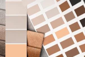 Fabrics and colour swatches that include Peach Fuzz and similar shades.