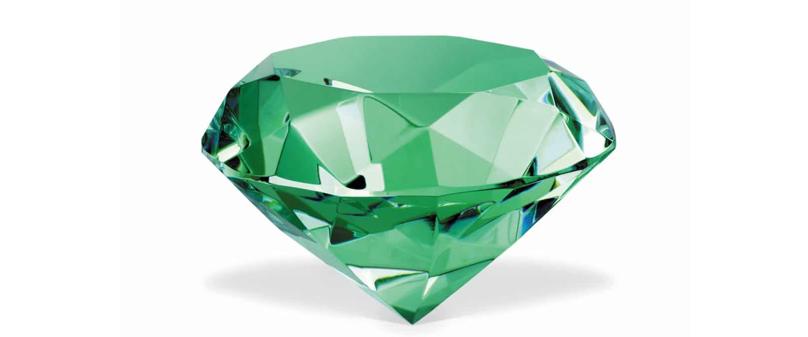 Close-up photograph of a brilliant green emerald.
