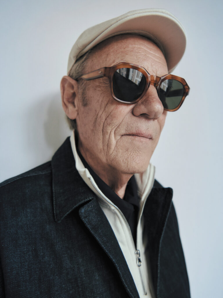 Older gentleman wearing GIGI STUDIOS fashionable hexagonal sunglasses.