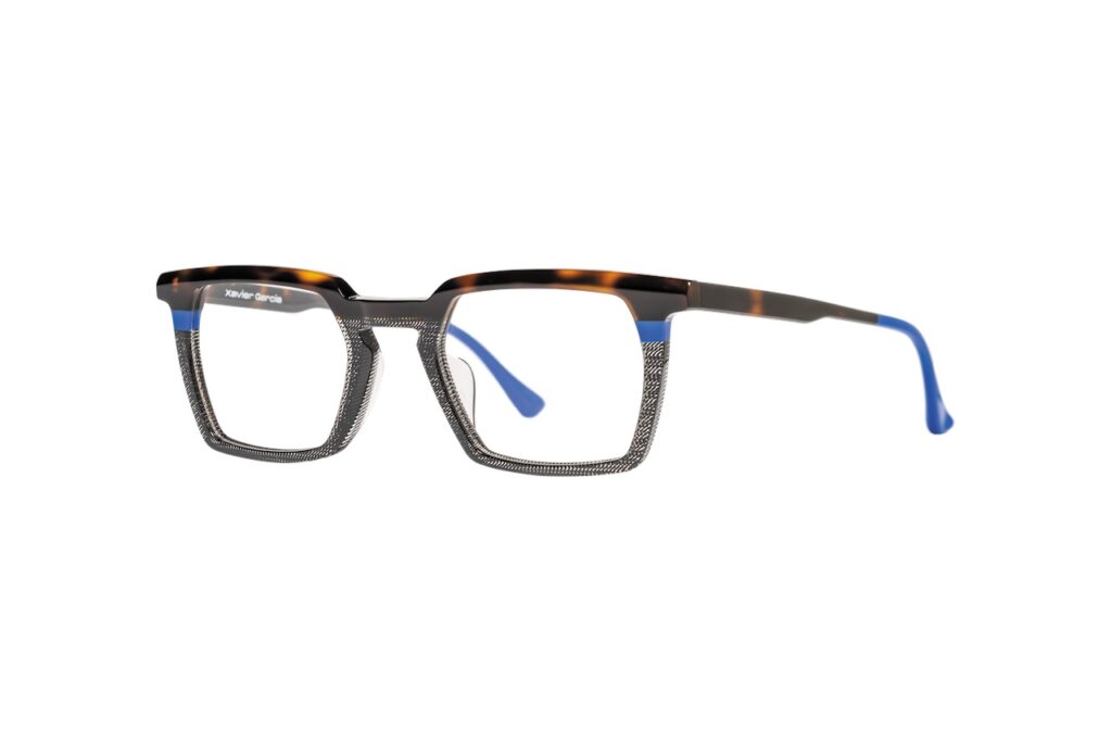 Elegant Xavier Garcia, OSMO eyeglasses with a detailed wire-frame design and blue temple tips.