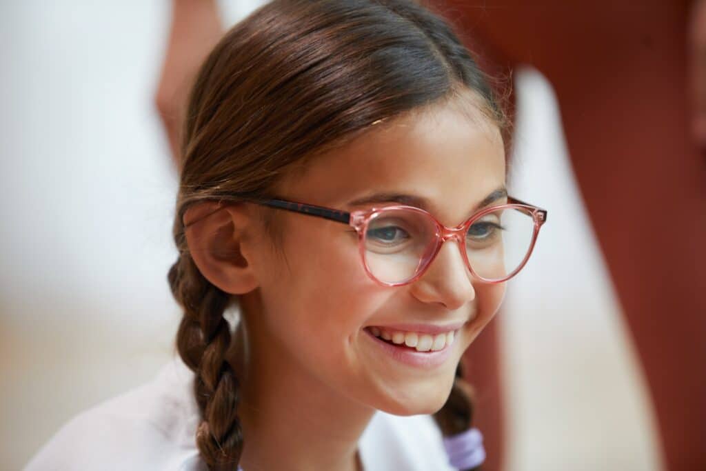 SightGlass Vision DOT spectacle lenses. Girl wearing glasses.